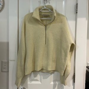 The felted merino half-zip sweater